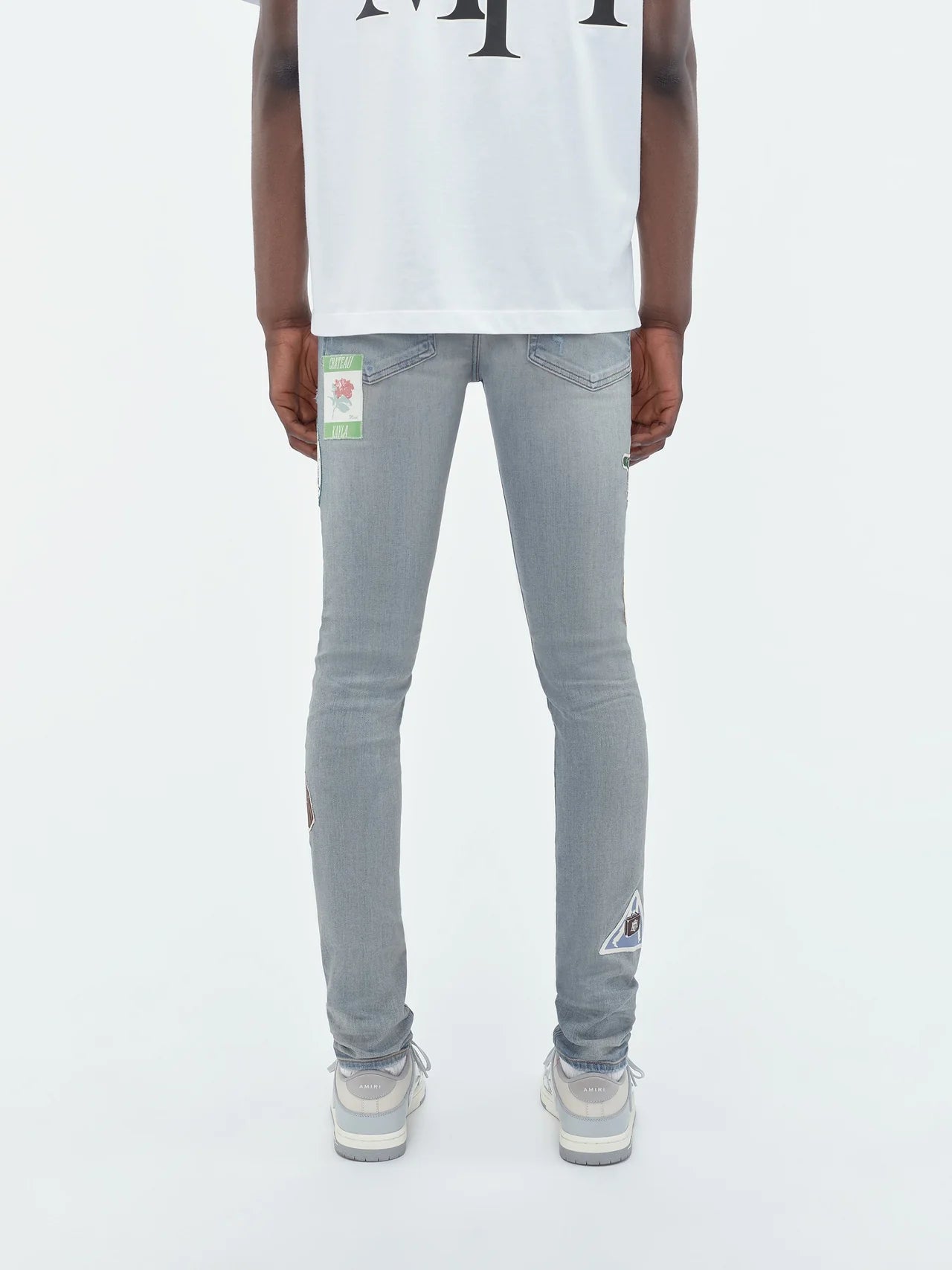 AMIRI TRAVEL PATCH REPAIR JEAN