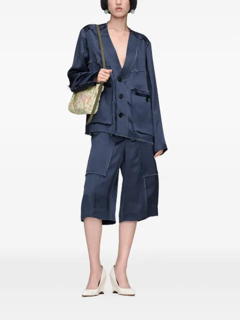 Maison Margiela shorts con detalles de panel y bordes deshilachados - imagen 2